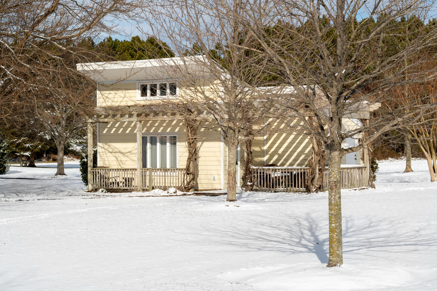 Pilot House cottage in the snow — quiet, warm inside
